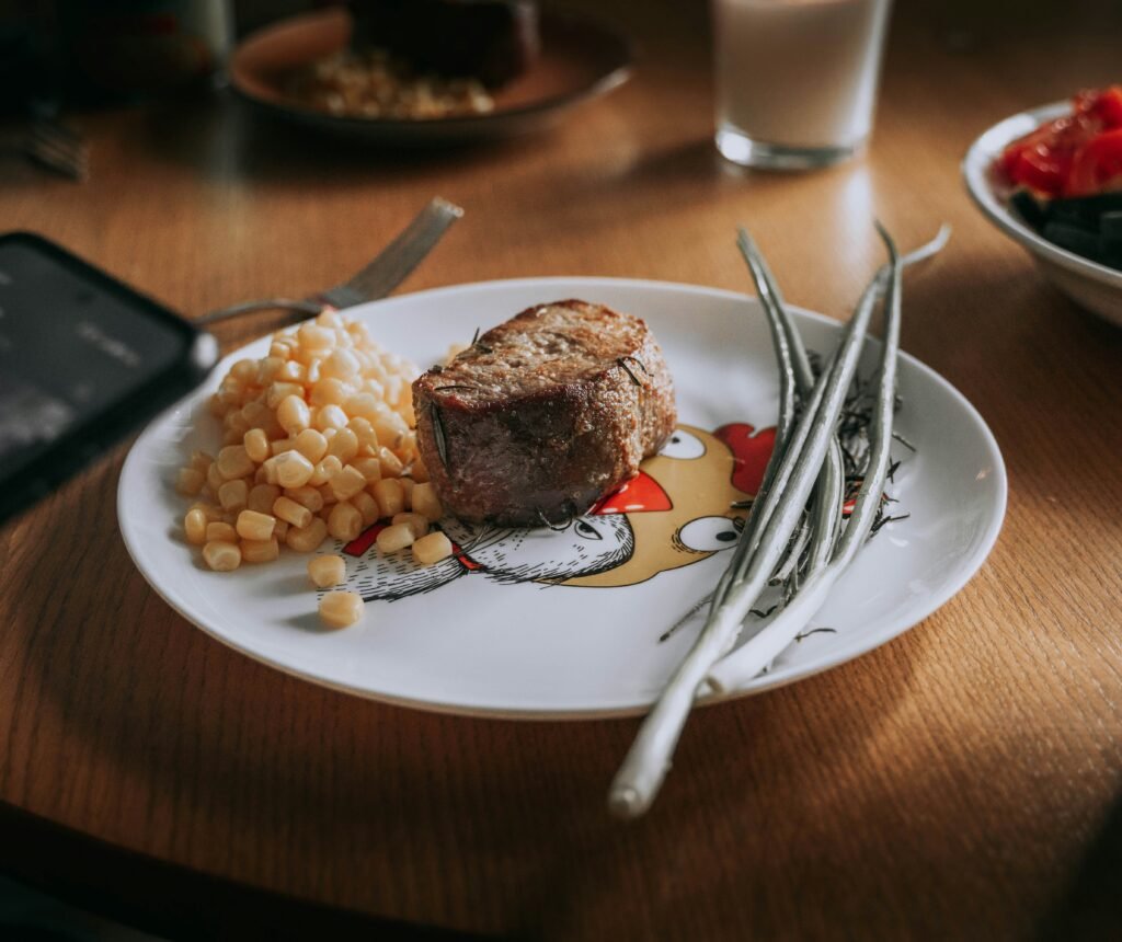 A plate of food on a wooden table